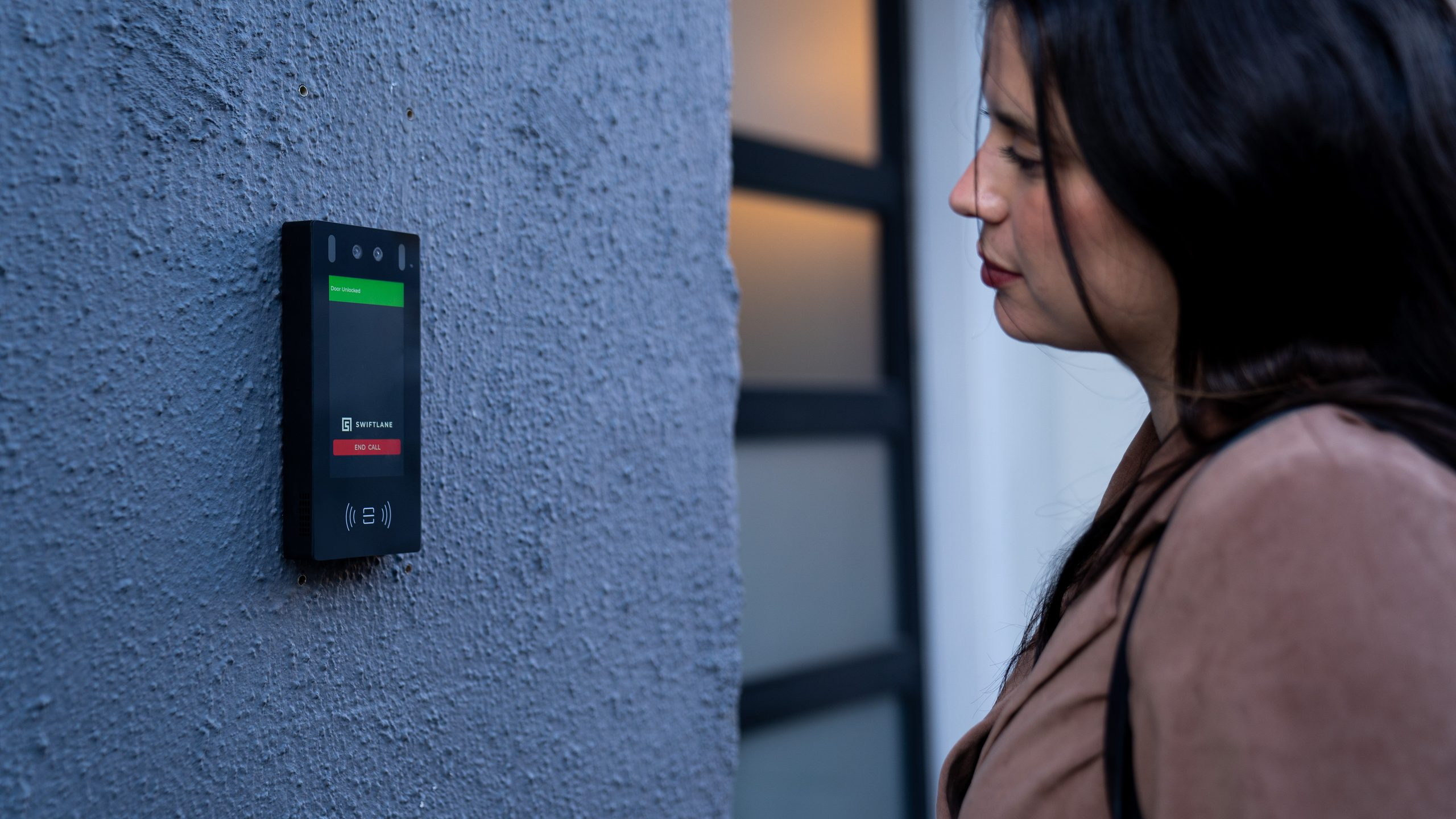 intercom mounted on a concrete wall