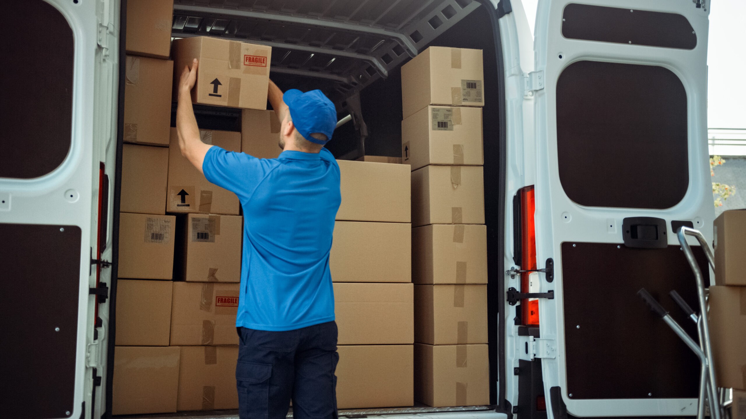 courier taking out a delivery box