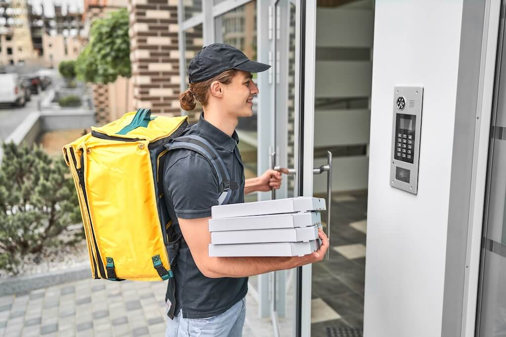 Delivery guy using the intercom