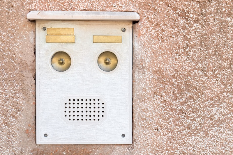 old intercom mounted on a wall
