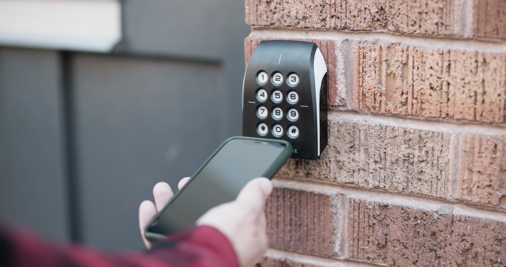 person using a Swiftlane reader to gain entry to a building