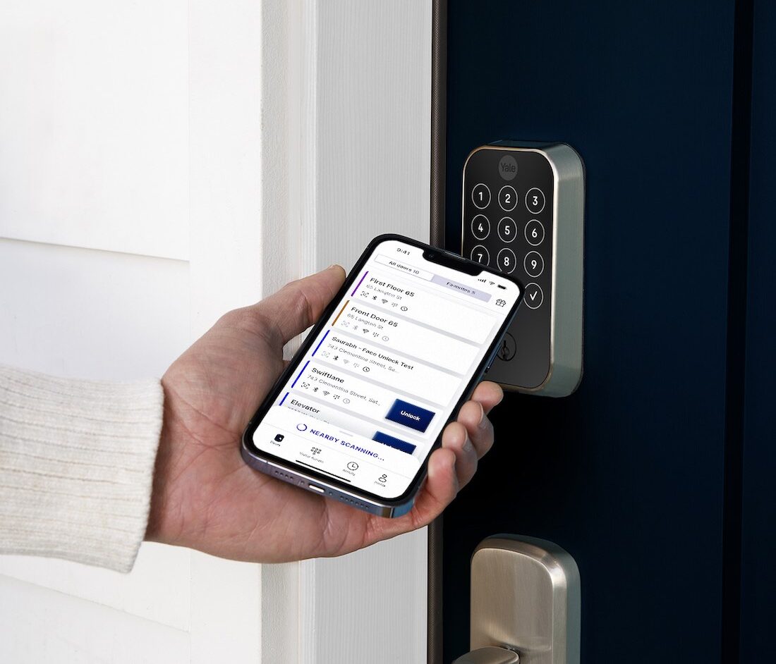 person using swiftlane mobile app with yale lock
