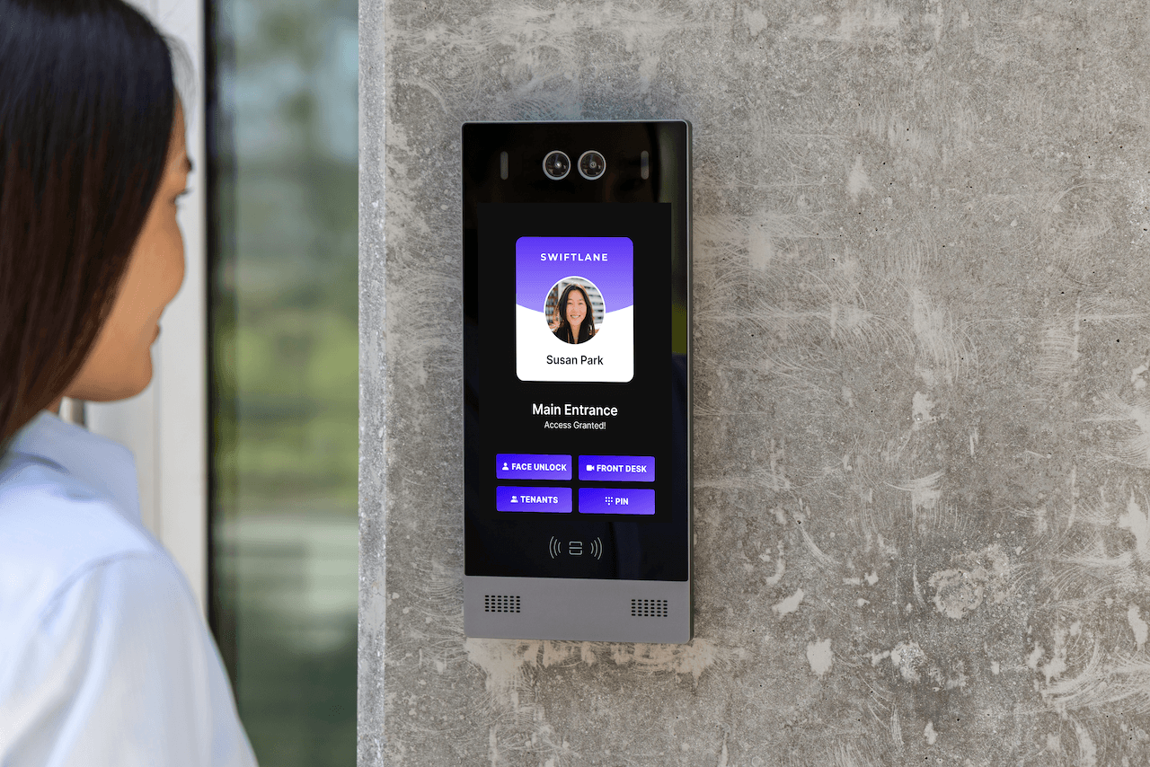 woman using the intercom to enter the building