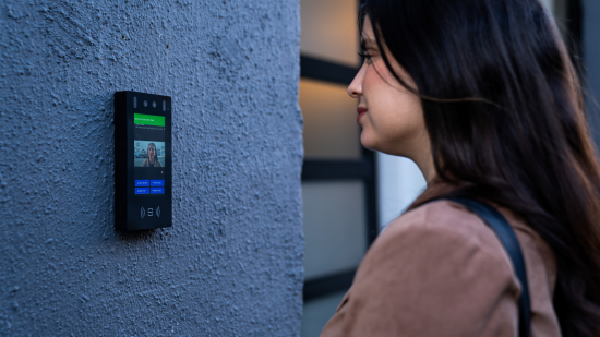 Woman using Swiftlane's Swiftvision intercom