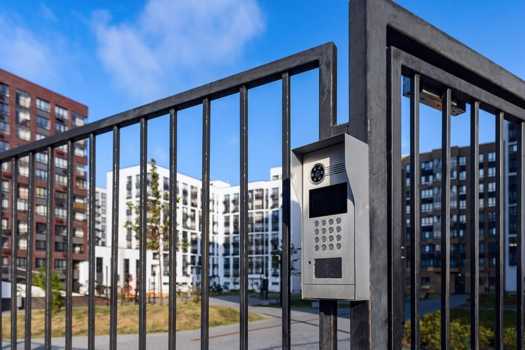 Electronic lock with buttons and intercom on the metal fence gate