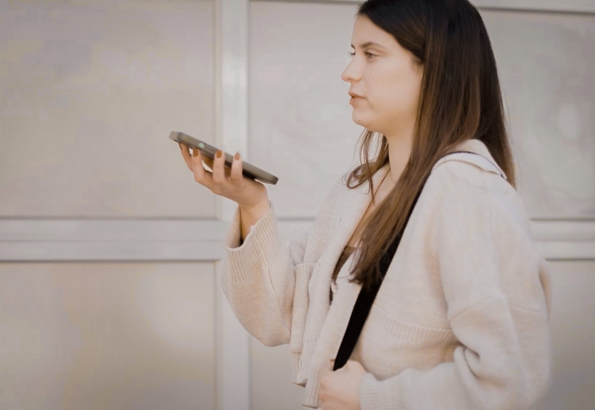 woman using voice activation to unlock intercom