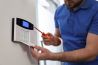 man installing intercom system