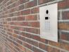 Modern Video Intercom Mounted on Brick Wall