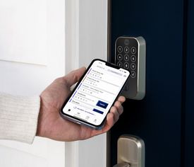 person using swiftlane mobile app with yale lock