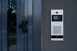 Video entrance doorbell in the entry of a modern house, technology and security concept