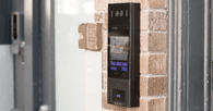swiftlane intercom mounted on a wall