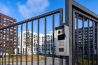 Electronic lock with buttons and intercom on the metal fence gate