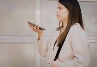 woman using voice activation to unlock intercom