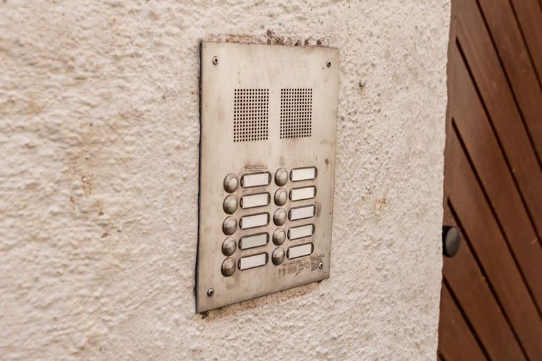 apartment buzzer placed on wall