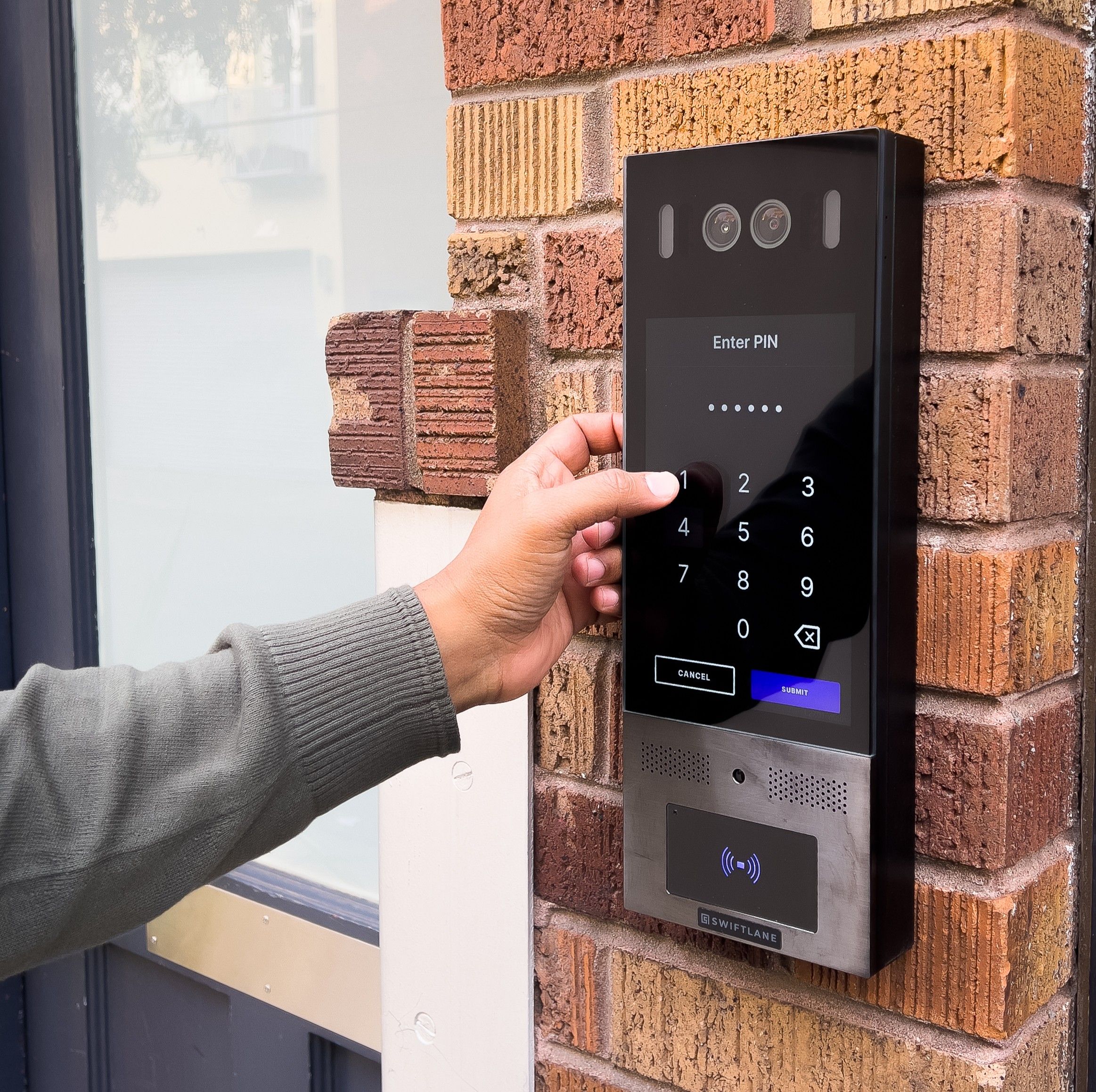 fingers pressing on an intercom