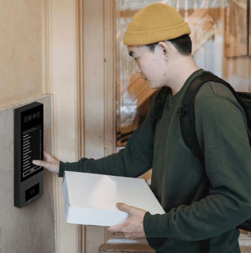 delivery person using swiftlane video intercom 