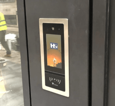 Paxton touch entry panel mounted on an entry door