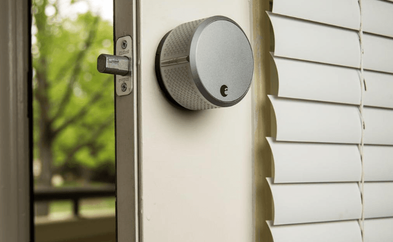 August Smart Lock placed on a door