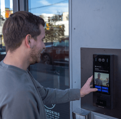 Man using a video intercom system