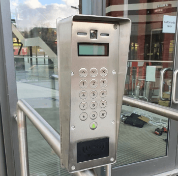 Paxton VR entry panel mounted on a glass entry door