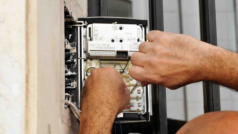 handyman installing an intercom