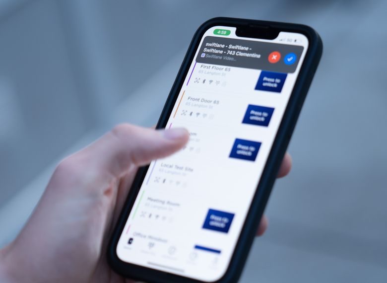 person using Swiftlane mobile application to open doors remotely